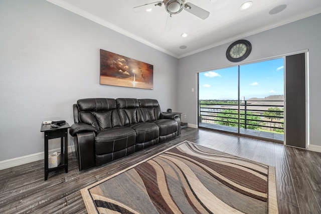 living room with ceiling fan, dark hardwood / wood-style flooring, and ornamental molding