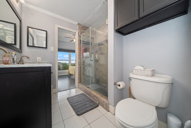 bathroom featuring vanity, crown molding, tile patterned flooring, toilet, and a shower with shower door