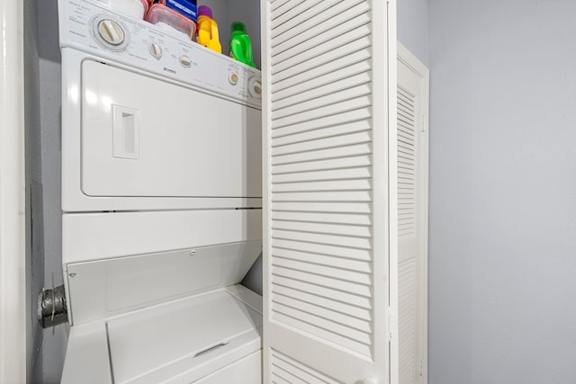 laundry area with stacked washer / drying machine