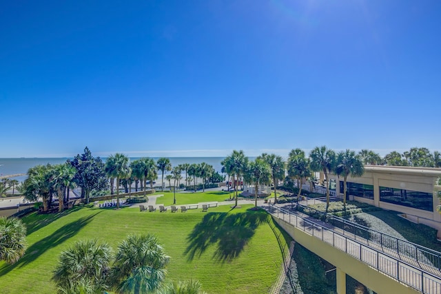 exterior space with a water view and a yard