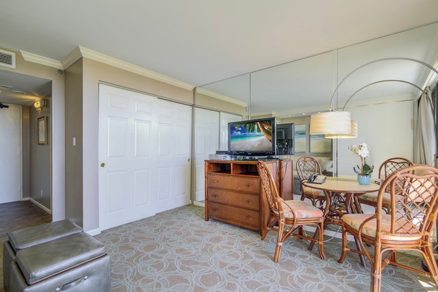 dining room featuring ornamental molding