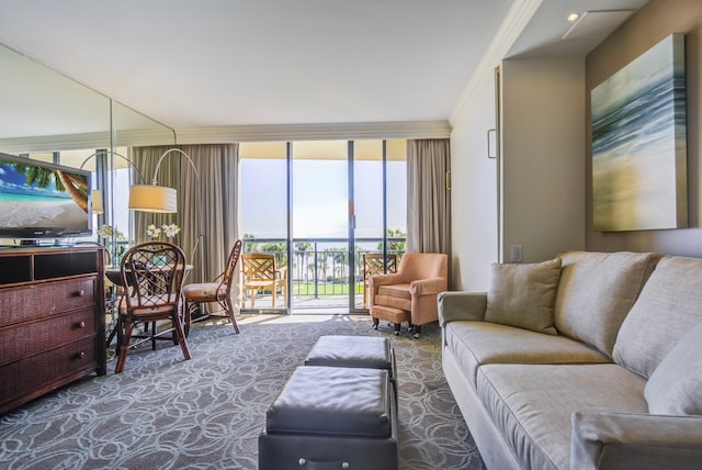 living room featuring carpet, ornamental molding, and floor to ceiling windows