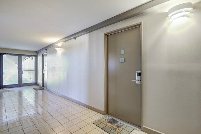 tiled empty room with french doors