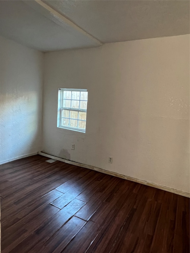 empty room featuring dark hardwood / wood-style floors