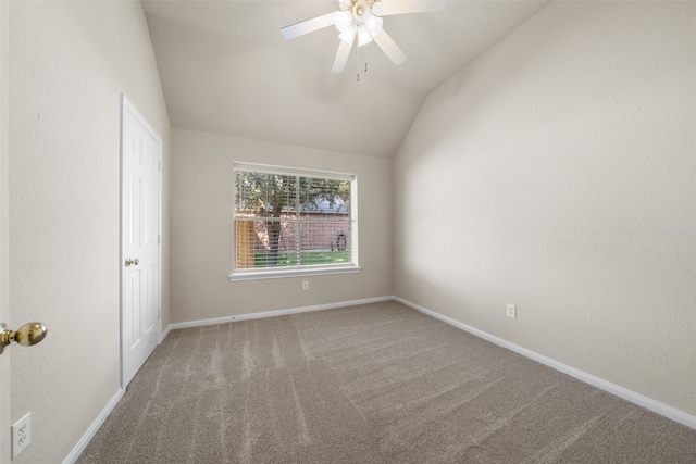 empty room with carpet floors, ceiling fan, and vaulted ceiling