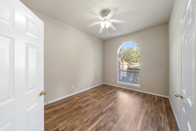 spare room featuring ceiling fan and hardwood / wood-style floors