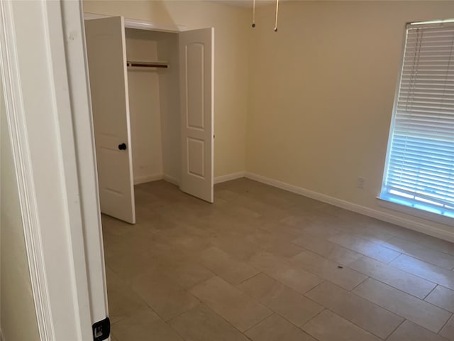 unfurnished bedroom with a closet