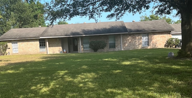 back of house with a yard