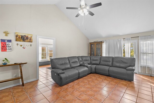 living room featuring ceiling fan, high vaulted ceiling, and light tile patterned floors