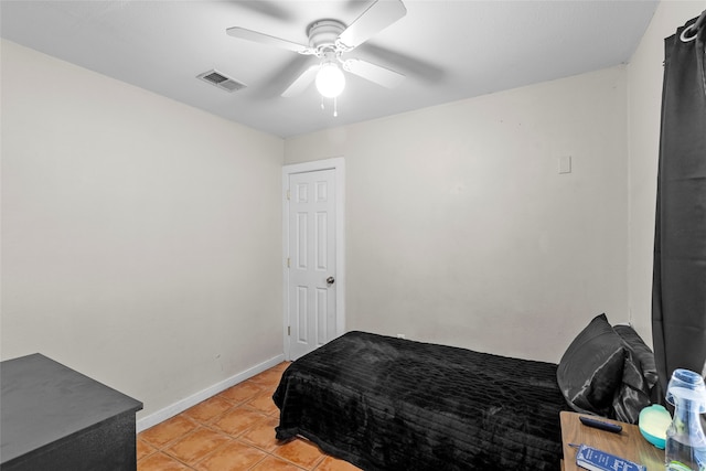 bedroom featuring light tile patterned floors and ceiling fan