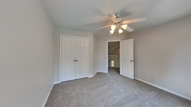 5802 Sugar Bush Dr, Magnolia, TX 77354 - unfurnished bedroom featuring a closet, baseboards, a ceiling fan, and carpet flooring
