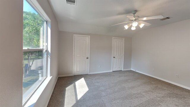 5802 Sugar Bush Dr, Magnolia, TX 77354 - unfurnished bedroom with carpet floors, baseboards, visible vents, and ceiling fan