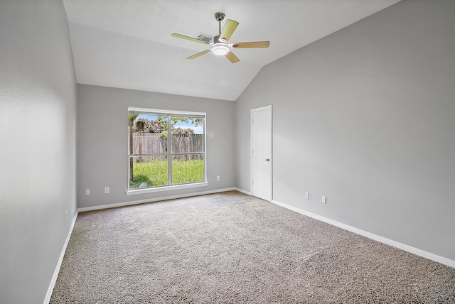 carpeted empty room featuring lofted ceiling and ceiling fan