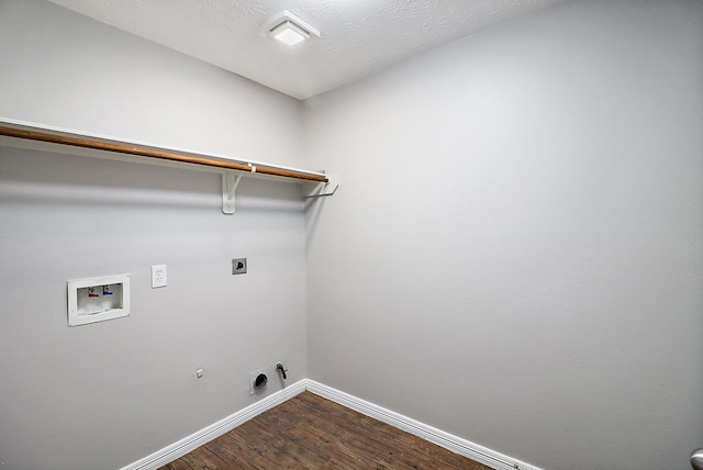 clothes washing area featuring hookup for a washing machine, hardwood / wood-style flooring, electric dryer hookup, and gas dryer hookup