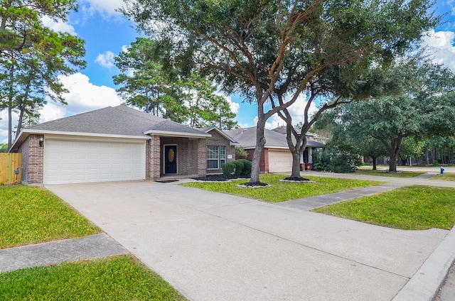 ranch-style home featuring a garage and a front yard