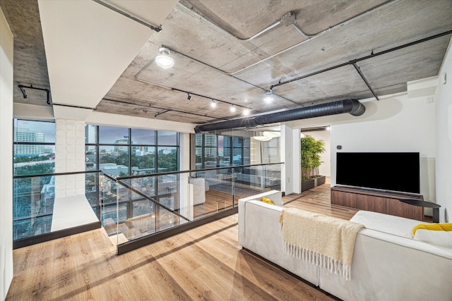 living room featuring hardwood / wood-style flooring and floor to ceiling windows