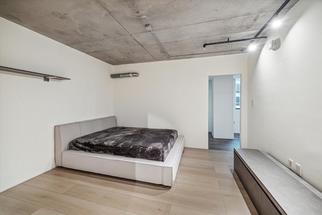 bedroom with light wood-type flooring