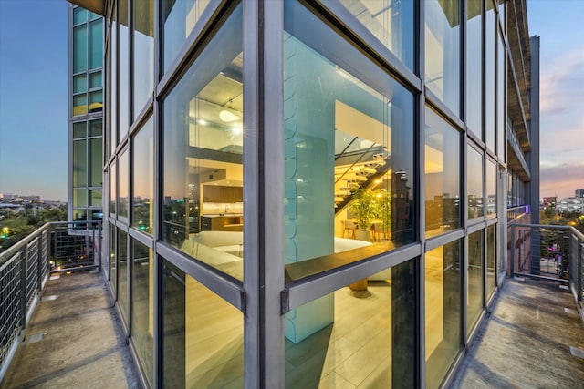 view of balcony at dusk