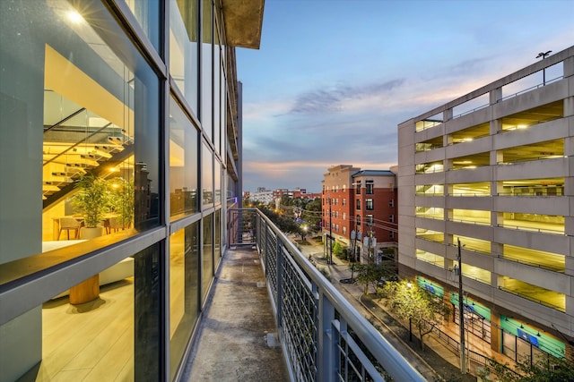 view of balcony at dusk