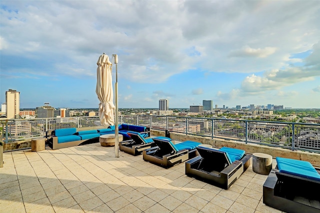 view of patio featuring an outdoor living space with a fire pit