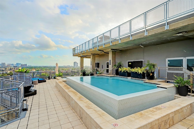 view of swimming pool featuring a patio