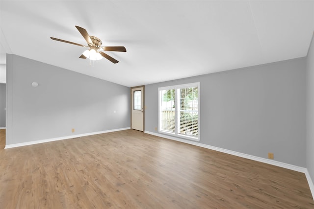 empty room featuring hardwood / wood-style floors and ceiling fan