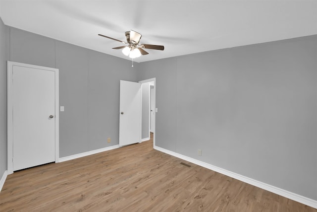 spare room with light hardwood / wood-style floors and ceiling fan