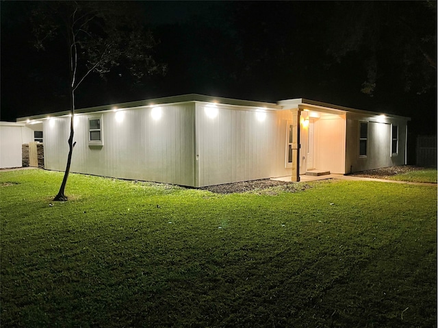 view of yard at twilight