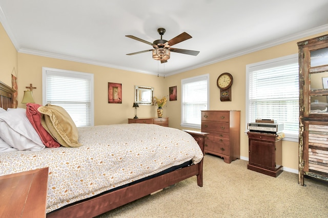 carpeted bedroom featuring ceiling fan and ornamental molding