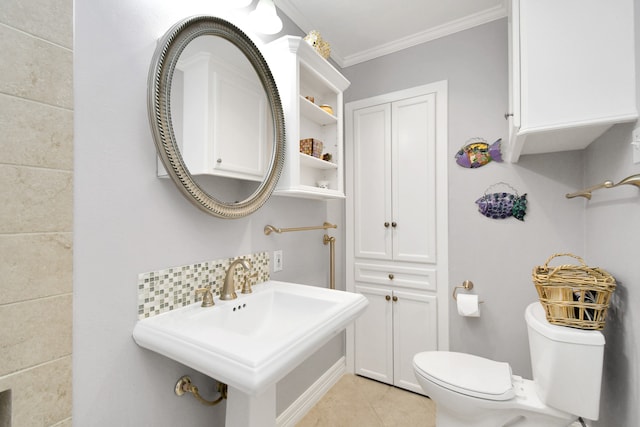 bathroom featuring sink, tile patterned flooring, backsplash, crown molding, and toilet