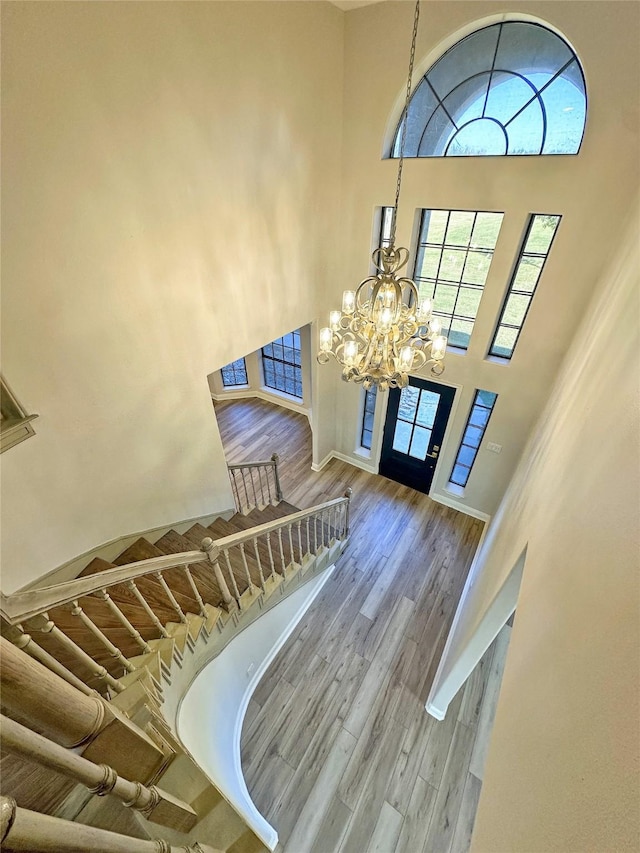 623 Barkaloo Rd, Baytown, TX 77521 - entrance foyer featuring a chandelier, wood finished floors, and a towering ceiling