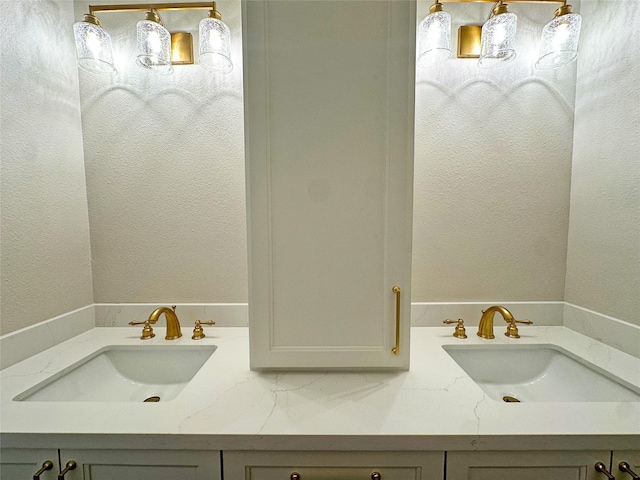623 Barkaloo Rd, Baytown, TX 77521 - bathroom featuring a textured wall and a sink