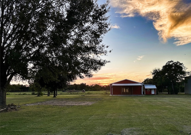 yard at dusk with an outdoor structure