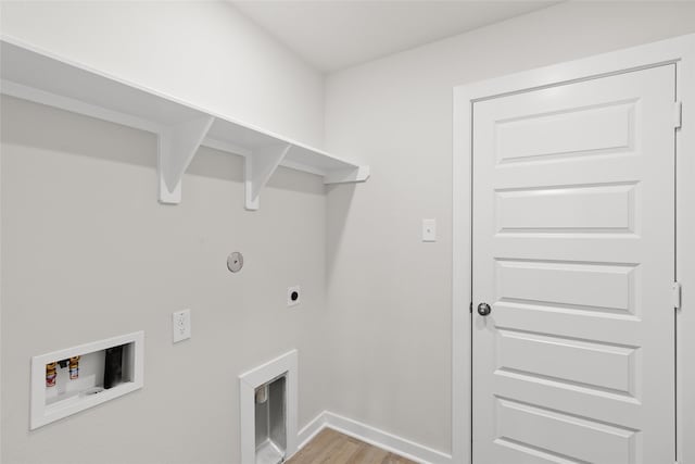 laundry area featuring electric dryer hookup, light hardwood / wood-style flooring, and washer hookup