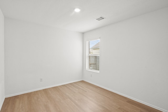 unfurnished room featuring light hardwood / wood-style flooring