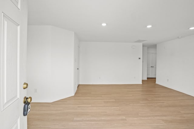 unfurnished room featuring light wood-type flooring