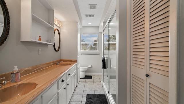 bathroom featuring toilet, an enclosed shower, and vanity