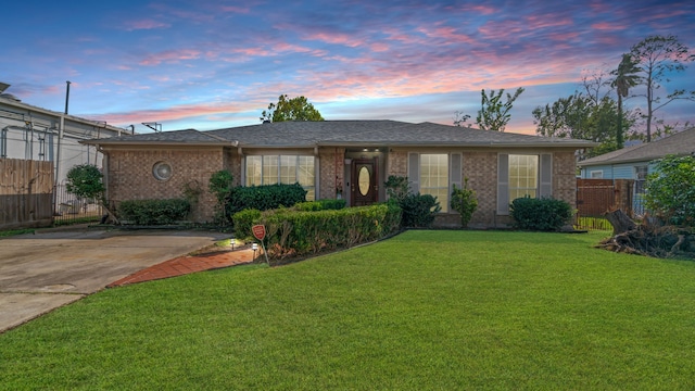 ranch-style house featuring a yard