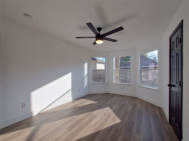 unfurnished room featuring hardwood / wood-style flooring and ceiling fan