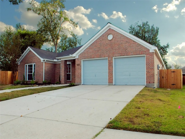 view of front facade with a garage and a front lawn