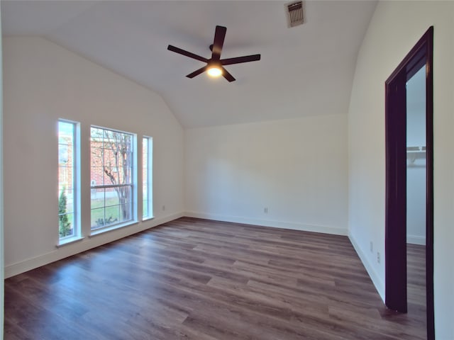 unfurnished room featuring a wealth of natural light and wood-type flooring