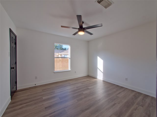 unfurnished room featuring hardwood / wood-style floors and ceiling fan