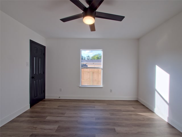 unfurnished room with hardwood / wood-style floors and ceiling fan