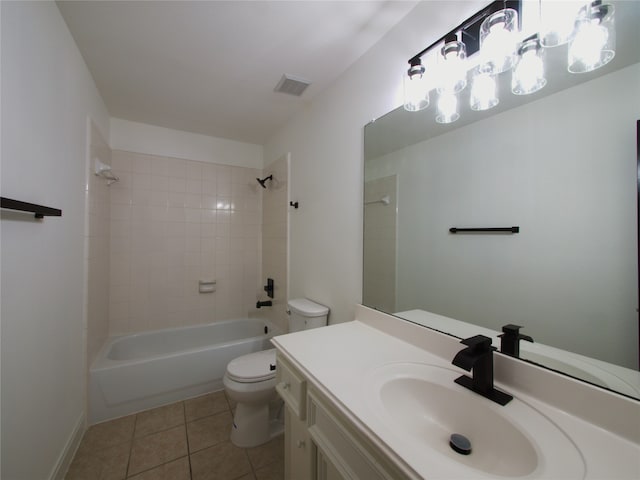 full bathroom featuring toilet, vanity, tiled shower / bath, and tile patterned floors