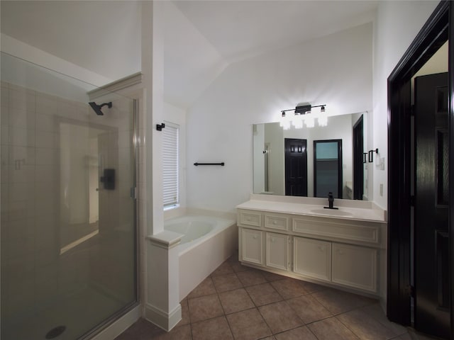 bathroom with vanity, tile patterned flooring, plus walk in shower, and vaulted ceiling