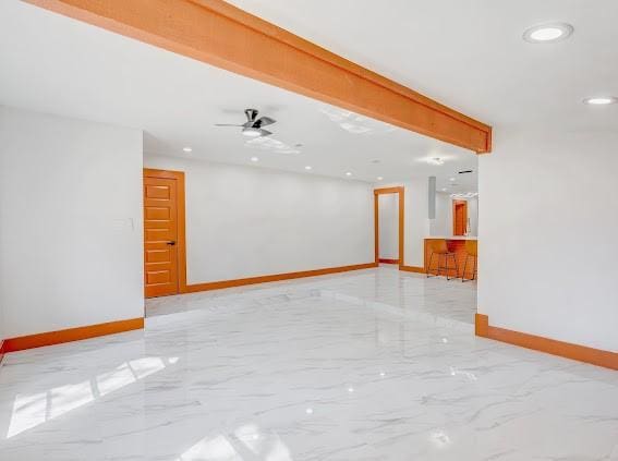 7311 La Mesa Dr, Houston, TX 77083 - unfurnished room featuring light marble finish floors, baseboards, recessed lighting, and a ceiling fan