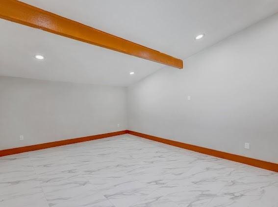7311 La Mesa Dr, Houston, TX 77083 - empty room featuring marble look tiles, baseboards, and recessed lighting