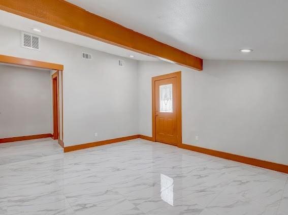 7311 La Mesa Dr, Houston, TX 77083 - below grade area featuring baseboards, light marble finish floors, and recessed lighting