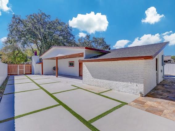 7311 La Mesa Dr, Houston, TX 77083 - garage with concrete driveway