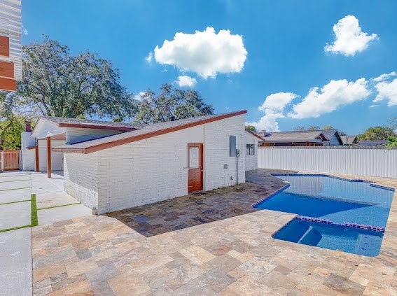 view of swimming pool featuring a patio